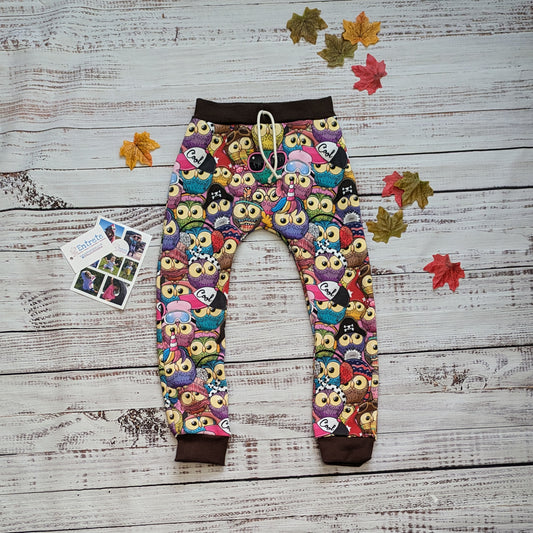 Colourful and fun cartoon owls harem joggers. Handmade using colourful owls cotton sweatshirt fleece and chocolate cotton ribbing.