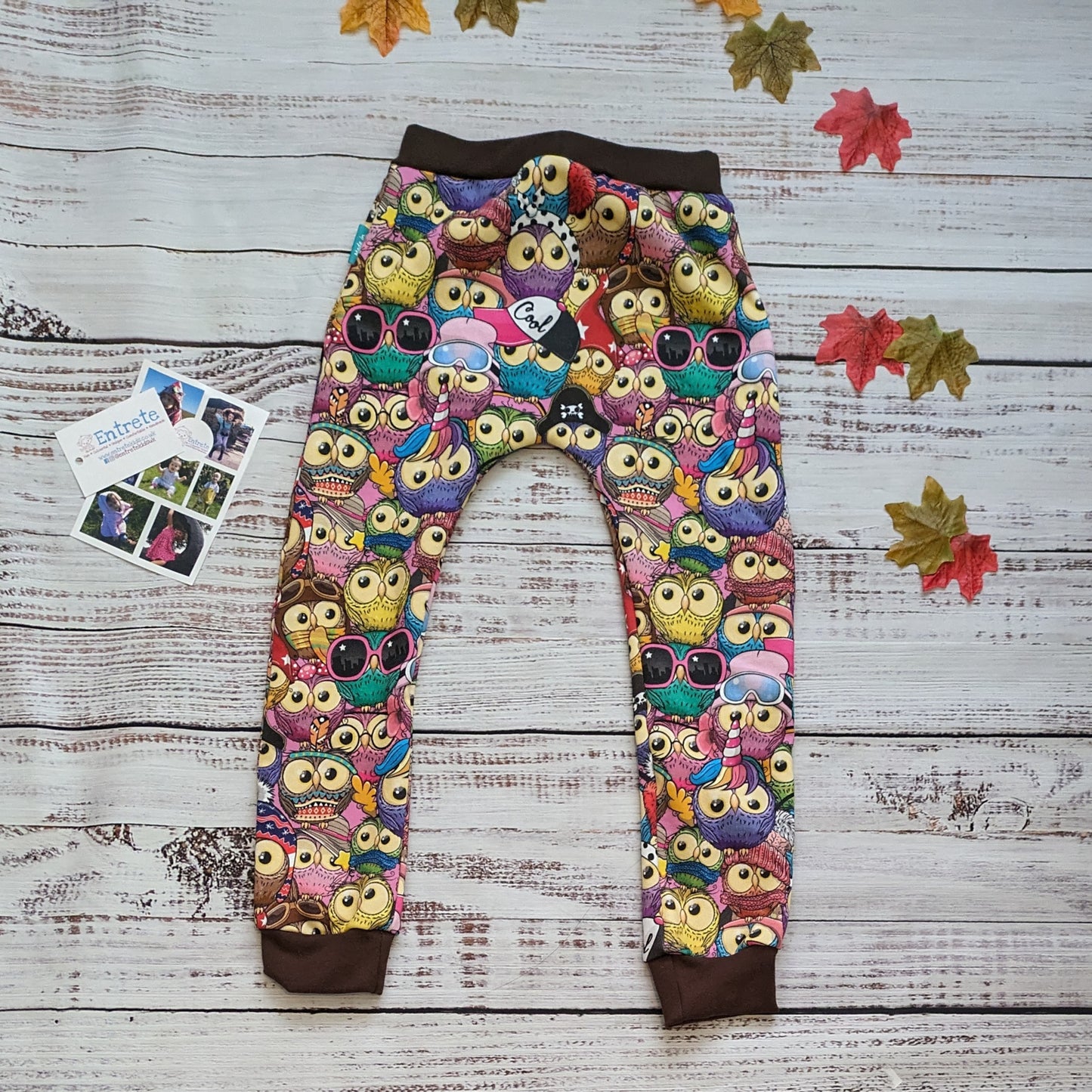 Colourful and fun cartoon owls harem joggers. Handmade using colourful owls cotton sweatshirt fleece and chocolate cotton ribbing. Shown from the rear.