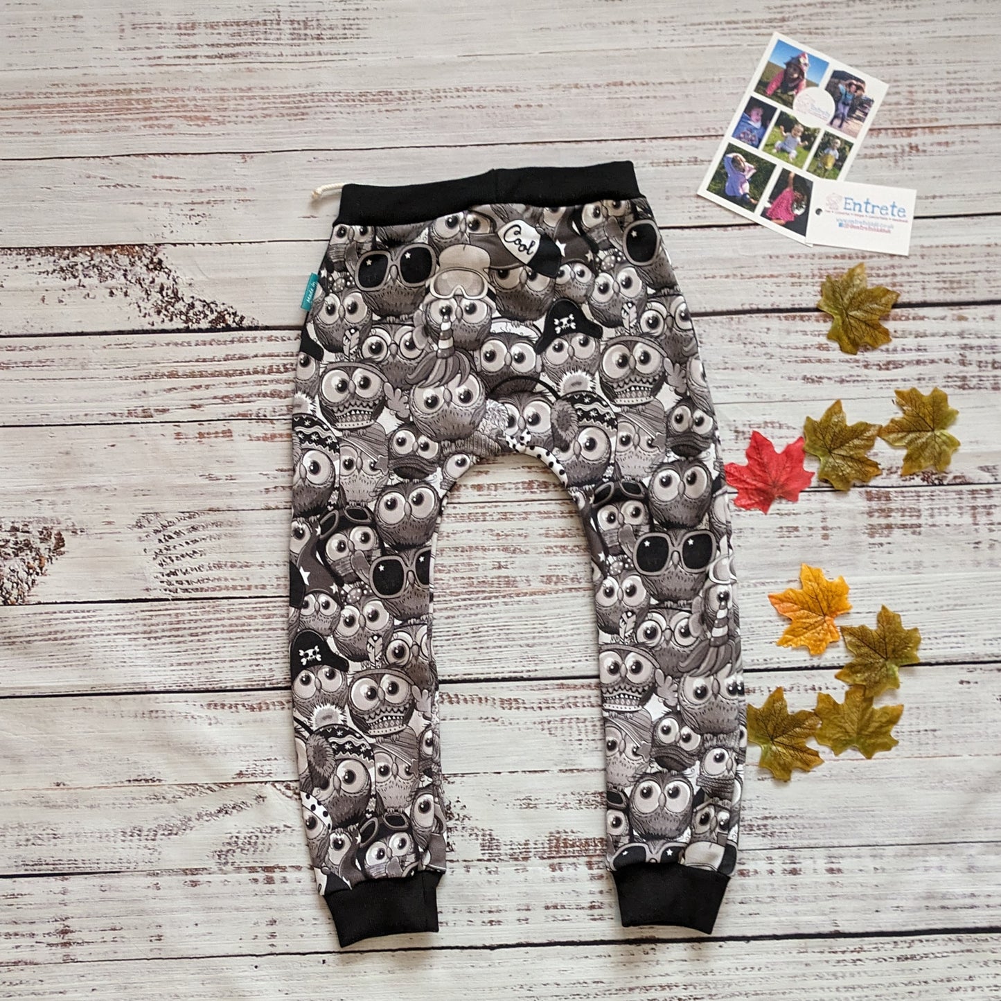 Fun, black and white cartoon owls harem joggers. Handmade using monochrome owls cotton sweatshirt fleece and black cotton ribbing. Shown from the rear.