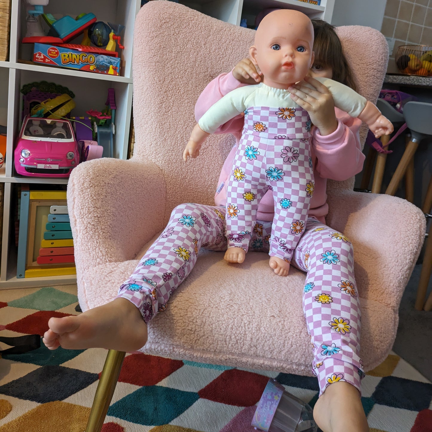 Sophie and her dolly rocking matching 'Mama' and mini pink checked happy flowers leggings.