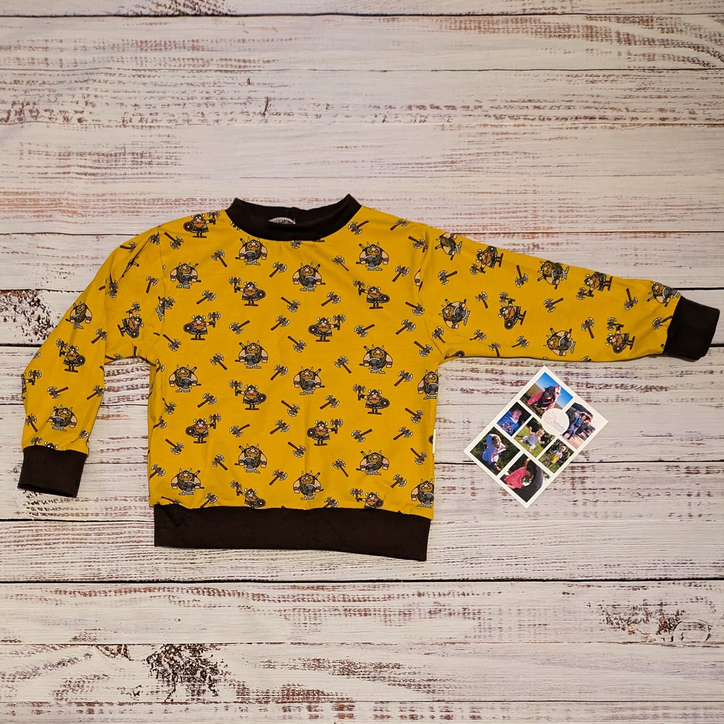 The fun mustard Vikings and chocolate unisex kids sweatshirt. Handmade using mustard Vikings cotton jersey and chocolate cotton ribbing.