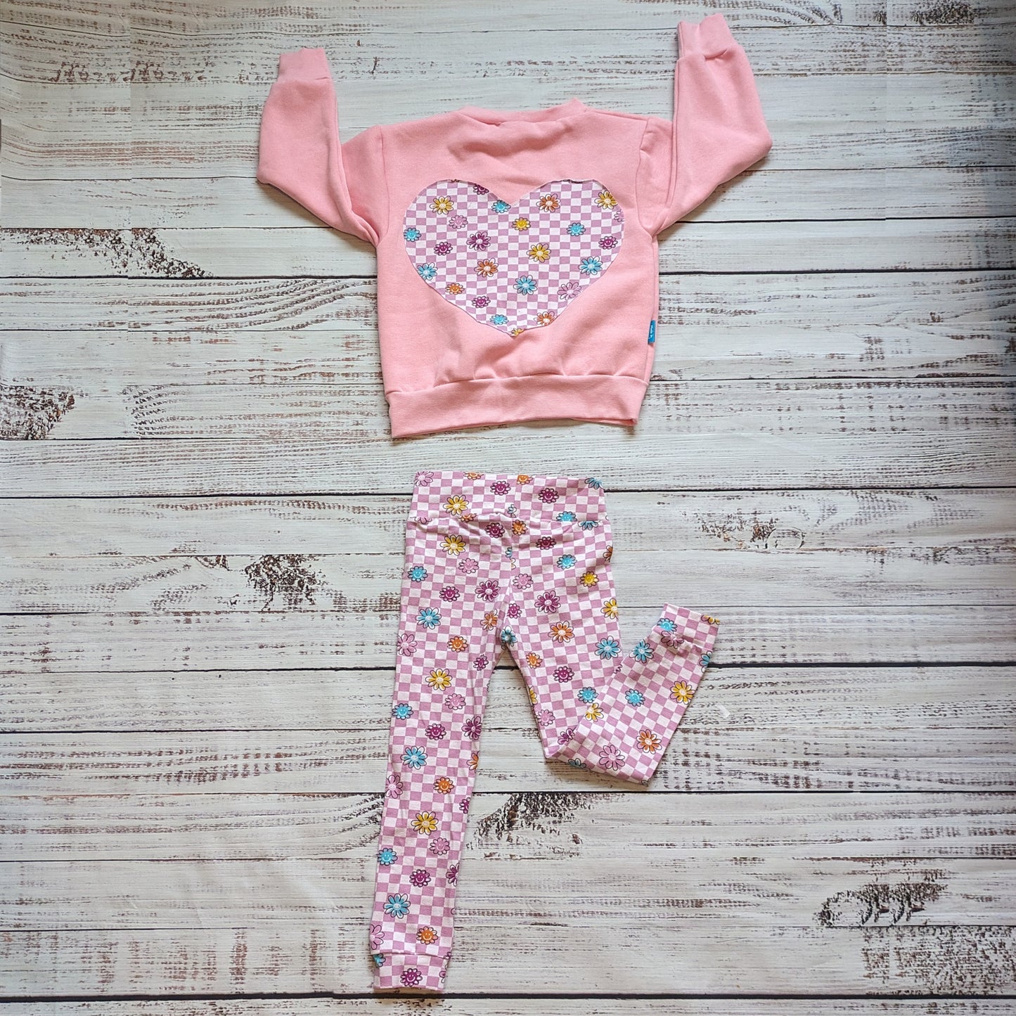 Also available, a pink checked happy flowers heart sweatshirt.