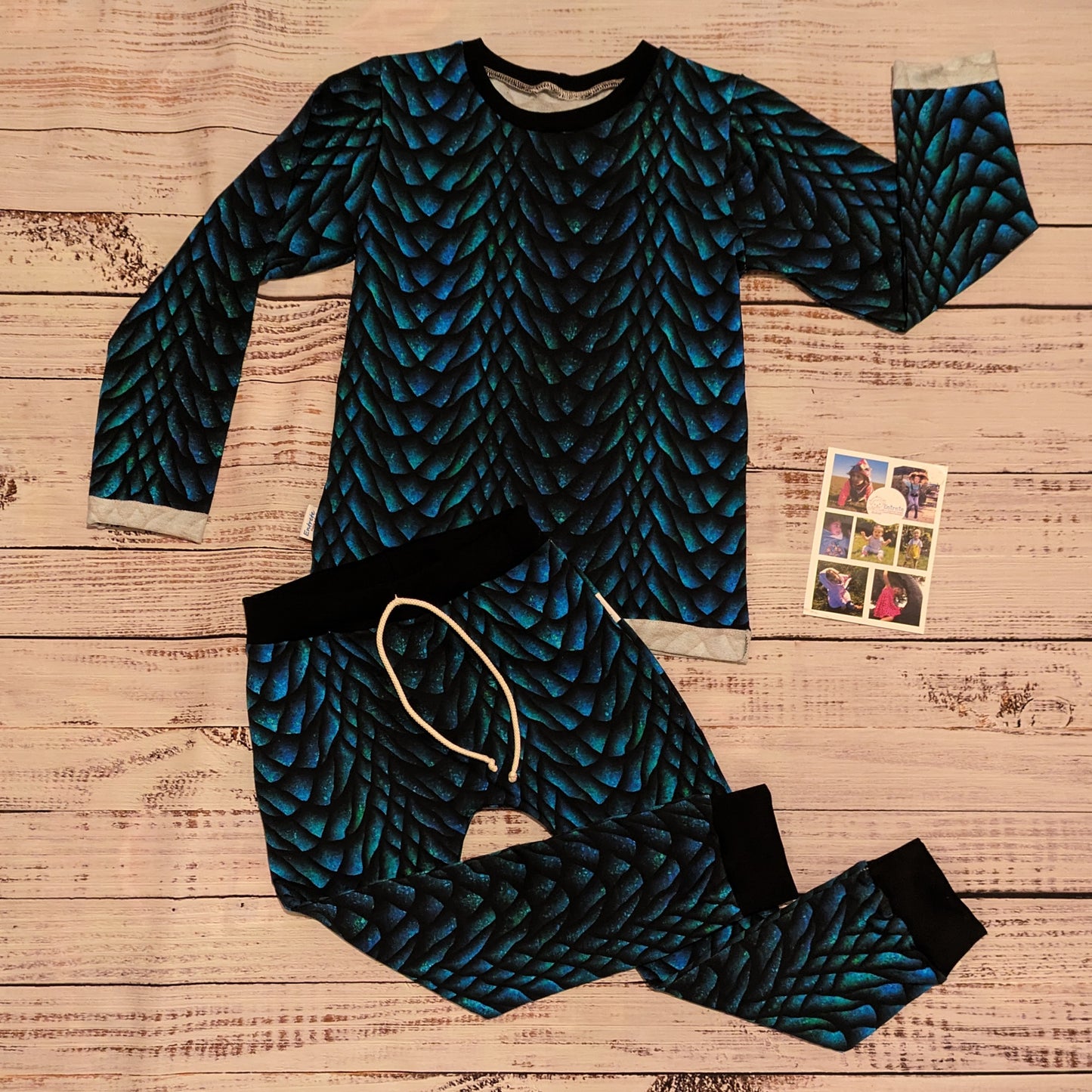 The gorgeously glimmering dragon scales harem joggers. Handmade using dragon scales cotton French terry and black cotton ribbing. Shown as a set with a matching tee.