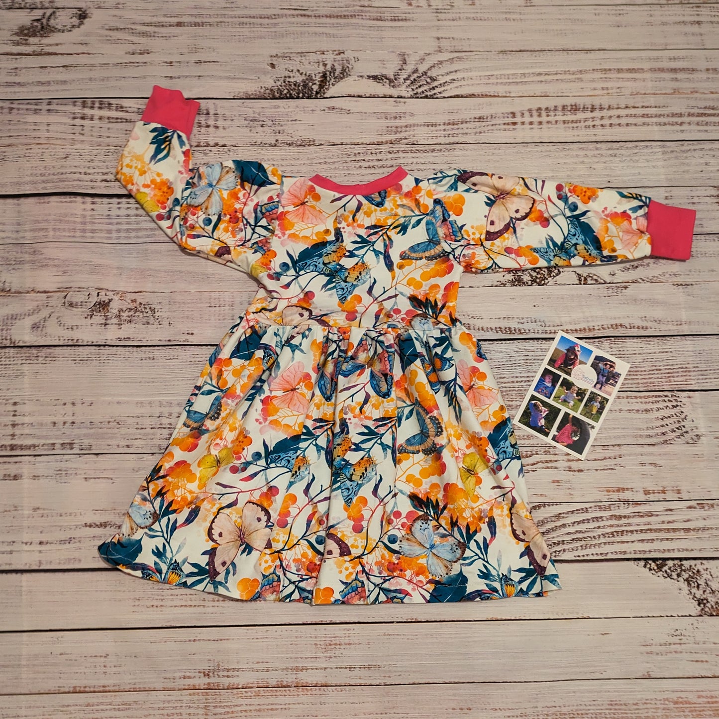 The warm and comfy winter dress, handmade using the gorgeously vibrant butterflies cotton French terry and fuchsia cotton ribbing. Shown from the back.