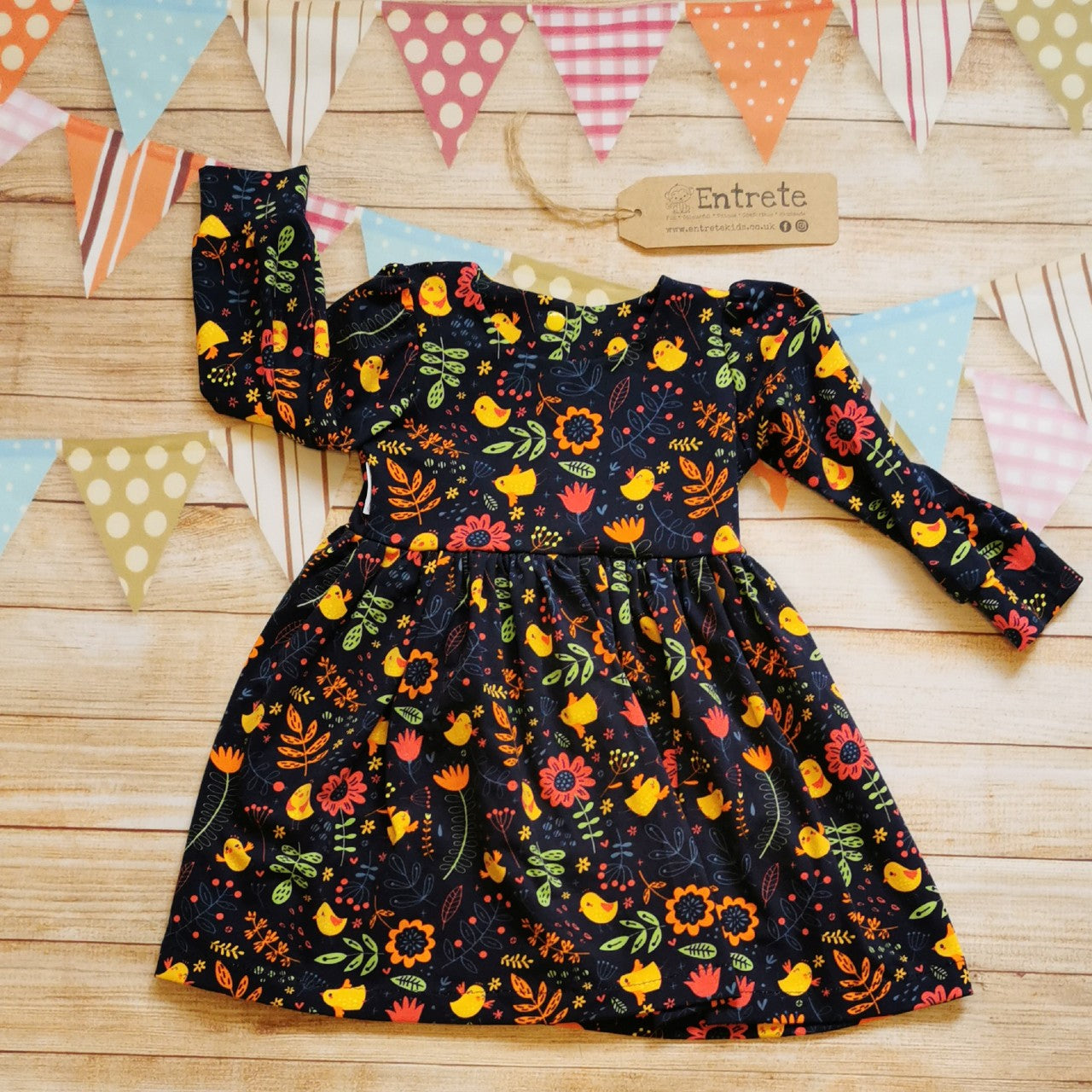 Long Sleeved girls back popper dress, handmade from the cute navy chicks cotton jersey.