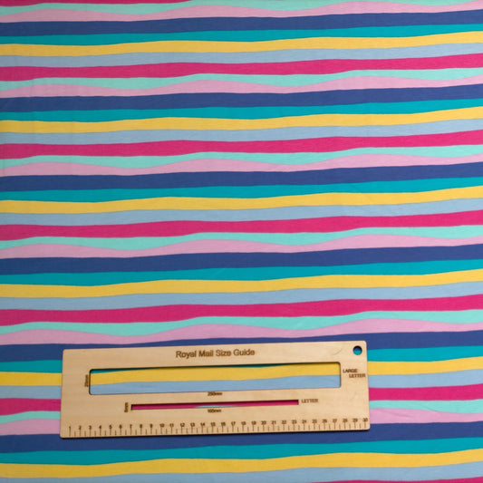 Your baby gift set will be handmade using cerise rainbow striped cotton jersey.