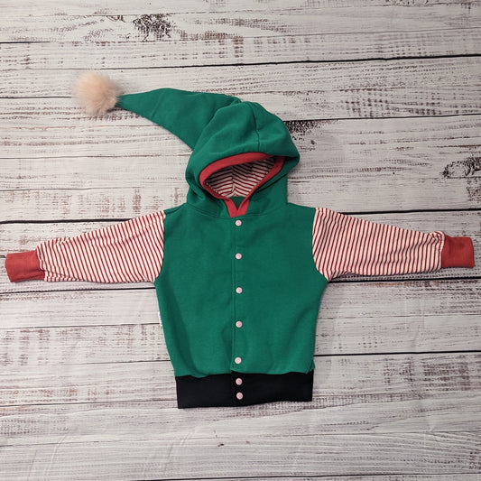 Fantastically fun reversible elf hoodie. Handmade in green cotton sweatshirt fleece, with red striped cotton jersey arms, graphite ribbing waist and red ribbing cuffs . With adorable pom-pom hood.