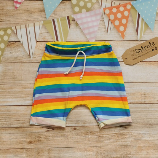 Unisex harem shorts, handmade from red rainbow striped cotton jersey. Featuring an elasticated waist, rolled ends and lowered crotch