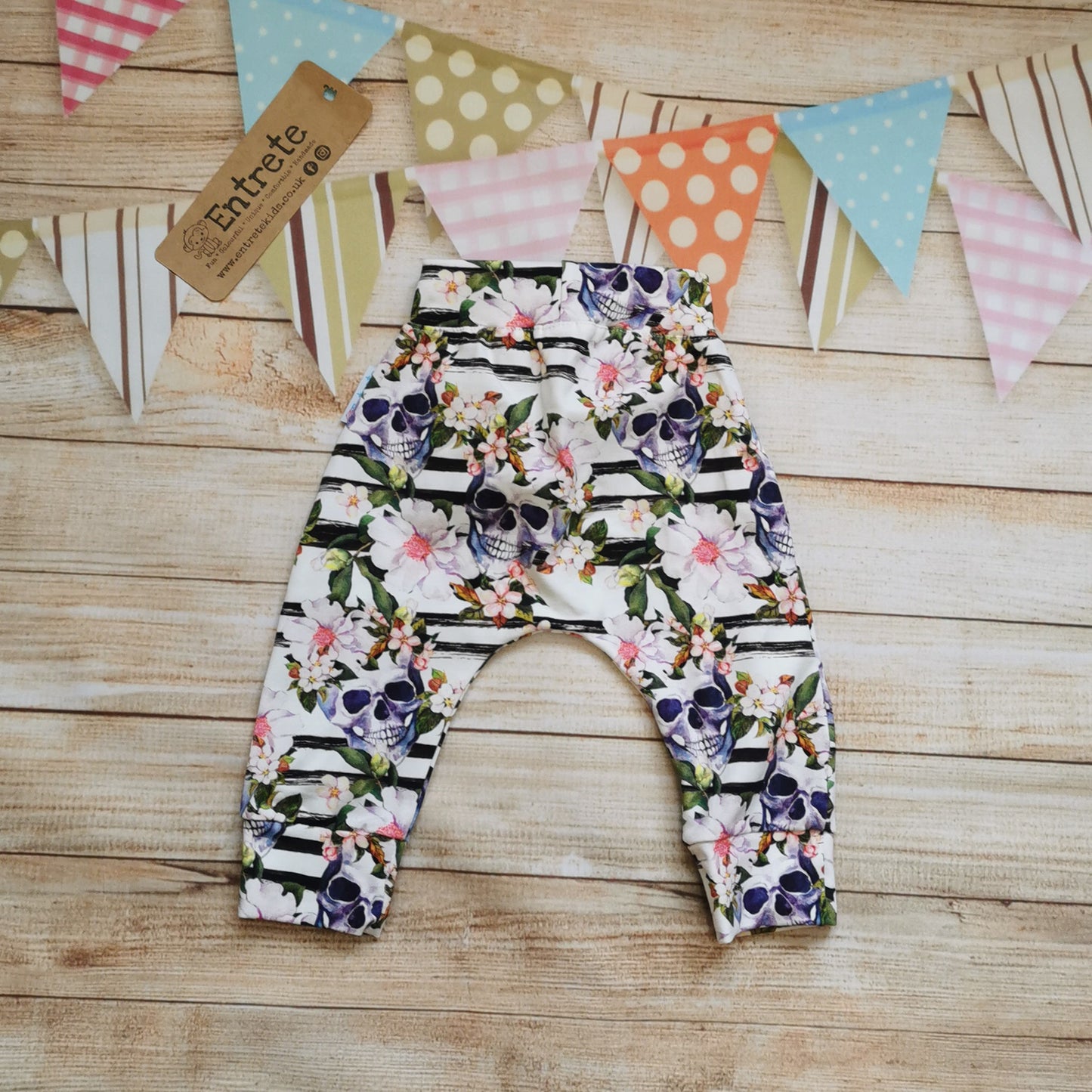 Rear view of the gorgeously gothic skulls and flowers cotton jersey harem joggers.