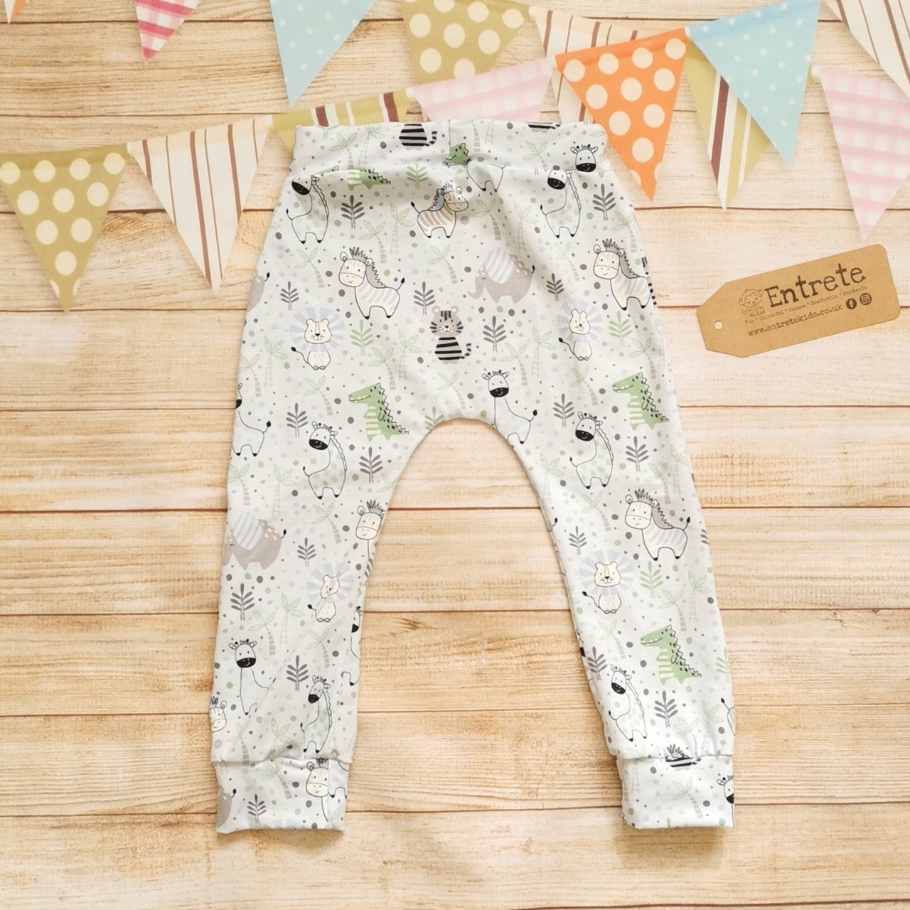 Rear view of the fun , light blue kids animals harem joggers. Featuring a lowered crotch, elasticated waist and roll-able ankle cuffs.