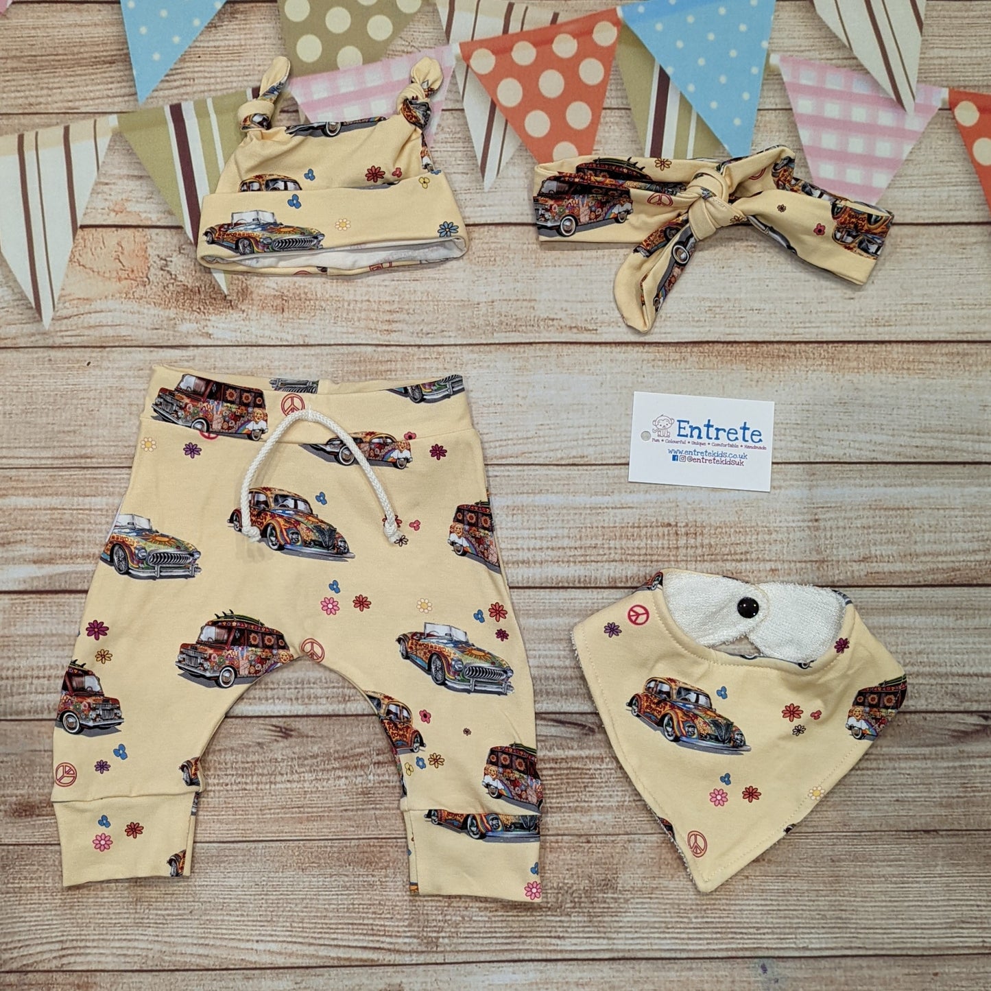 The fun retro hippie cars harem joggers, handmade using light yellow hippie cars cotton jersey. Shown with matching bamboo bib, tie top hat and headband.