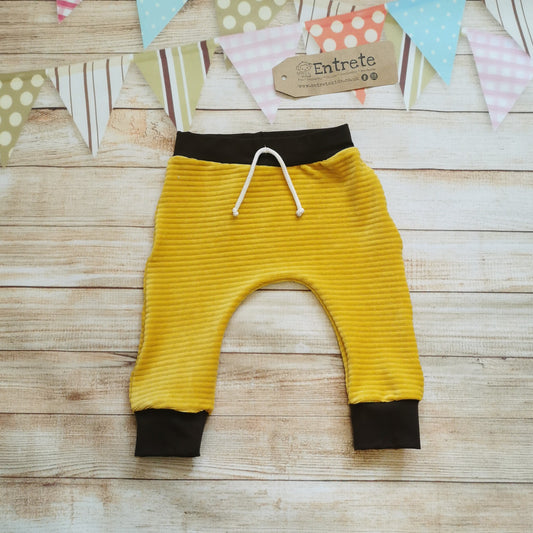Front view of the delicious ochre corduroy and chocolate harem joggers.