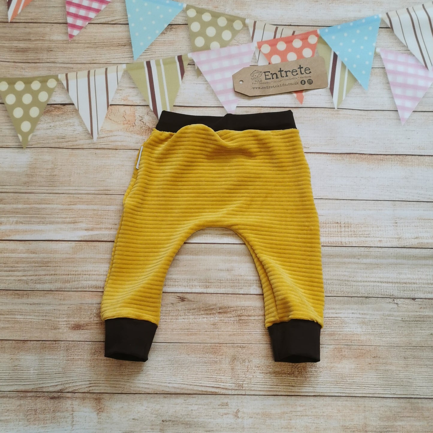 Rear view of the delicious ochre corduroy and chocolate harem joggers.