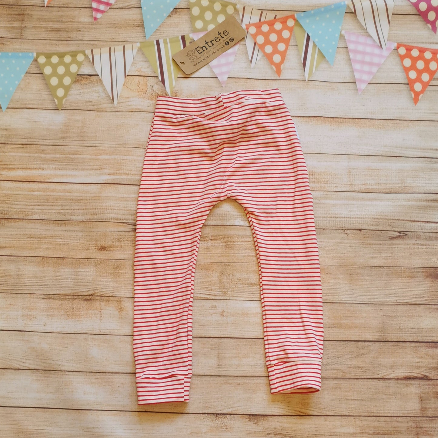 Rear view of soft and comfy harem joggers, handmade using red striped cotton jersey.