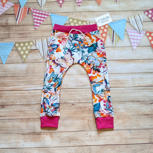Vibrant butterflies harem joggers, handmade using vibrant butterflies cotton jersey and fuchsia cotton ribbing.