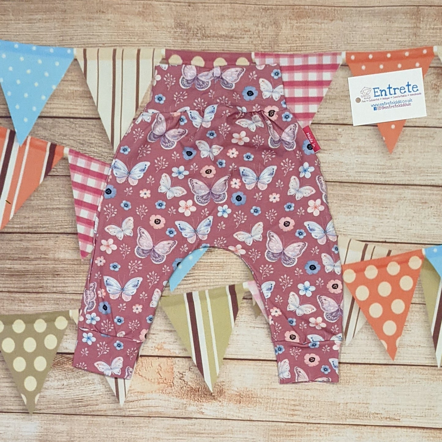 Pretty pink butterflies organic harem pants. Handmade using organic pink butterflies cotton jersey. Shown from the rear.