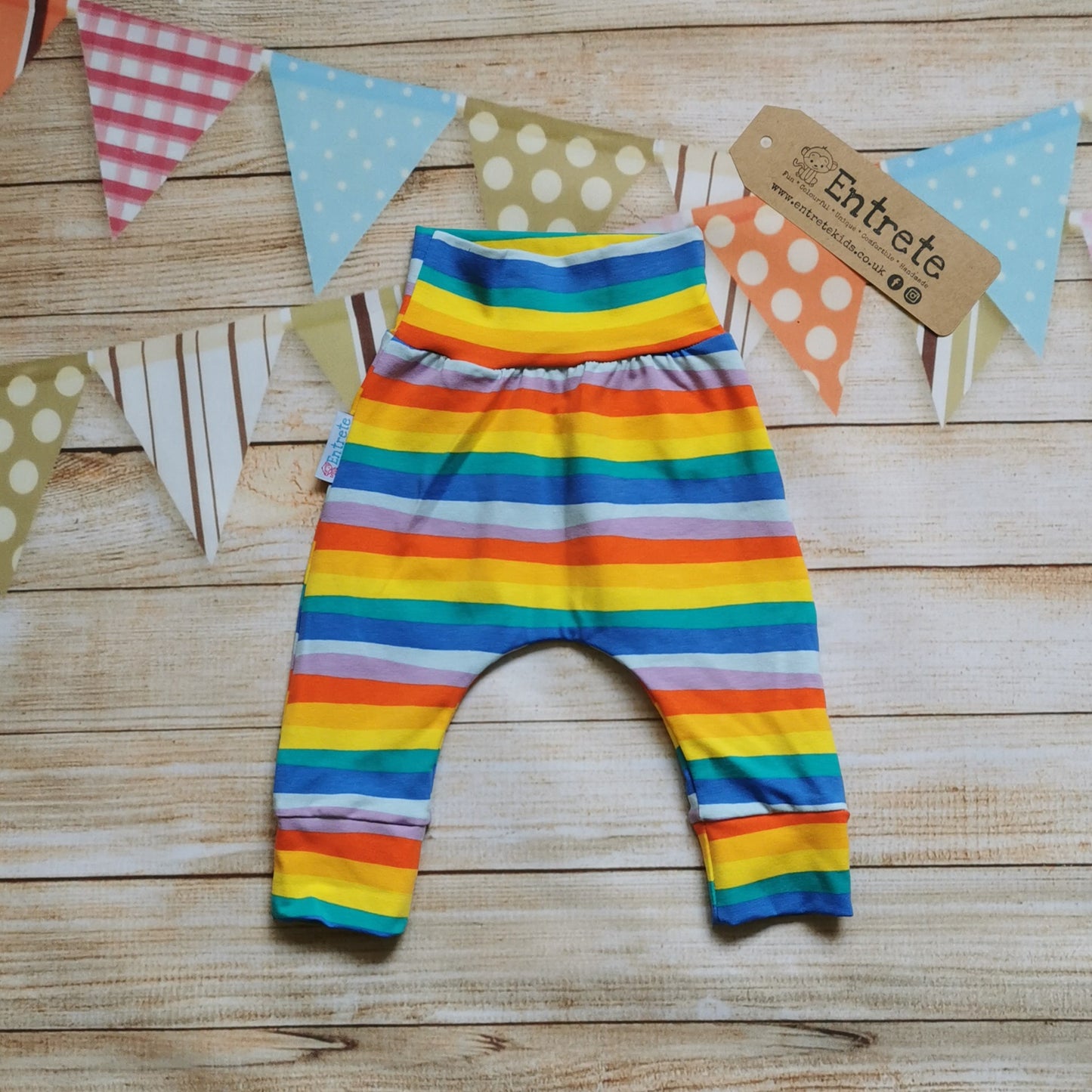 Soft and stretchy red rainbow striped cotton jersey harem pants.