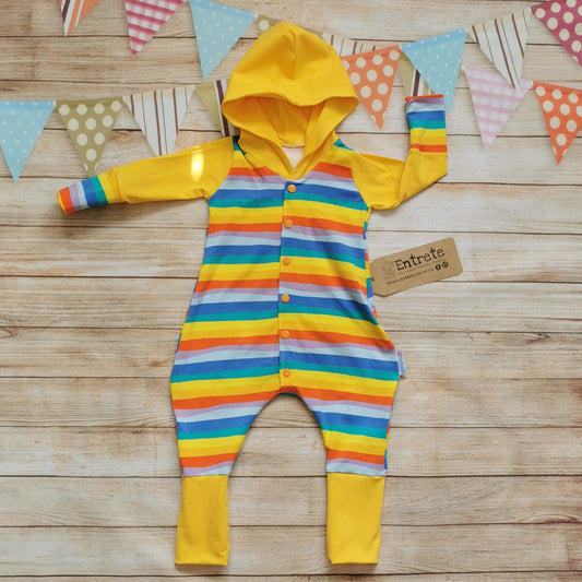 Front of Unisex kids hooded popper romper, handmade with red rainbow striped cotton jersey body and cuffs, organic yellow cotton jersey hood, arms and lower legs.