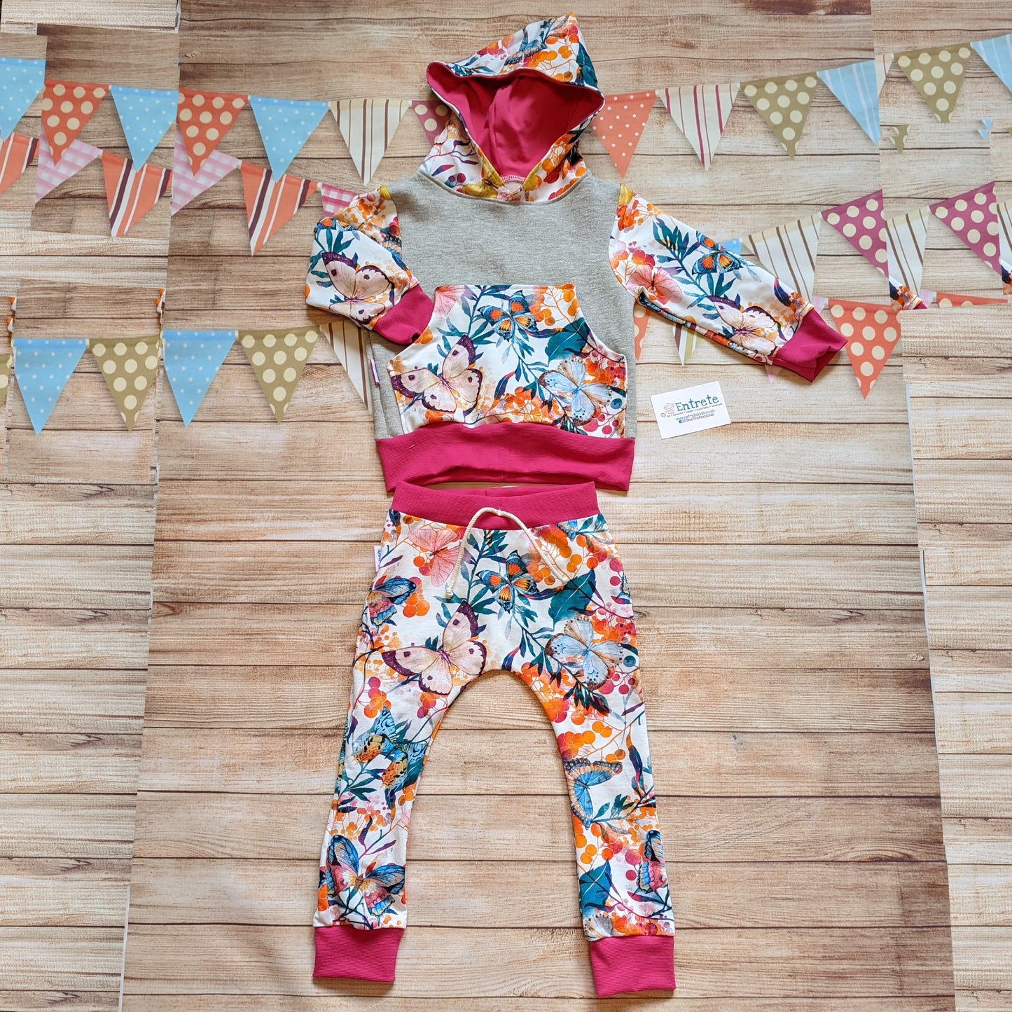 Vibrant butterflies harem joggers, shown as an outfit with a matching hoodie.
