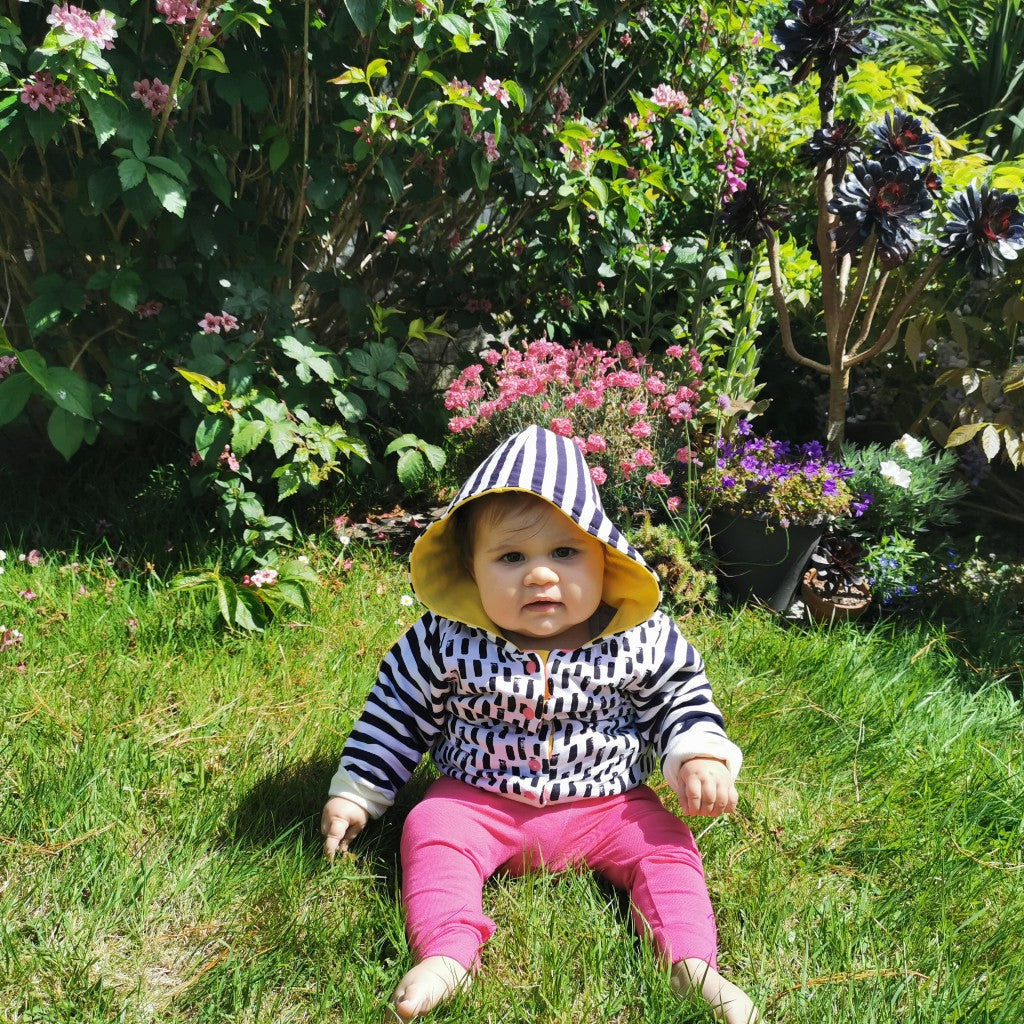 Fuchsia organic harem pants shown as an outfit with a matching reversible hoodie. (sold separately)