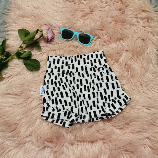 Colourful girls shorts, handmade from soft and stretchy monochrome abstract stripe cotton jersey. With A comfortable non-elasticated waist.