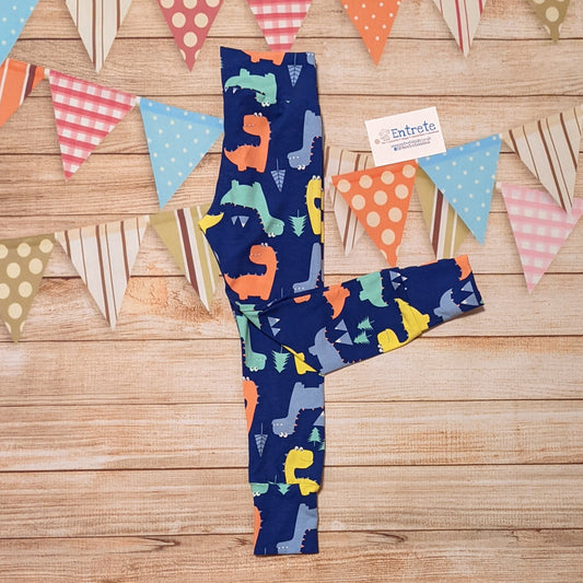 Prehistorically fun blue dinosaur leggings, shown folded. Handmade using blue dinosaurs cotton jersey.