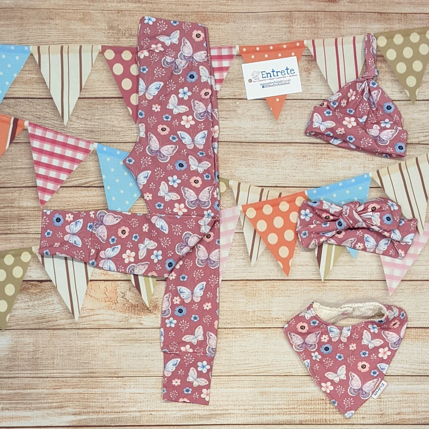 Pretty organic pink butterflies leggings, handmade using organic pink butterflies cotton jersey. Shown with a matching tie top hat, headband and bamboo bib.