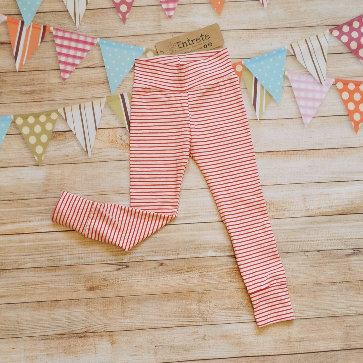 Soft and comfortable leggings handmade using red striped cotton jersey. Shown from the front.