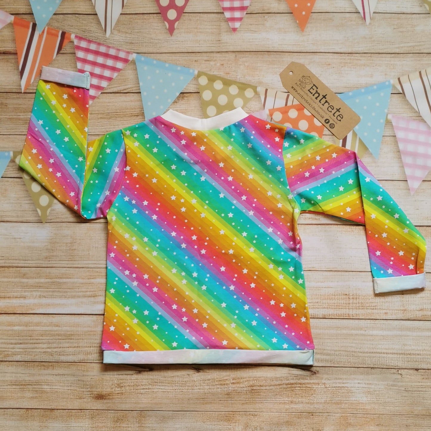 Back view of the vivid bright rainbow stars long sleeve T-shirt.