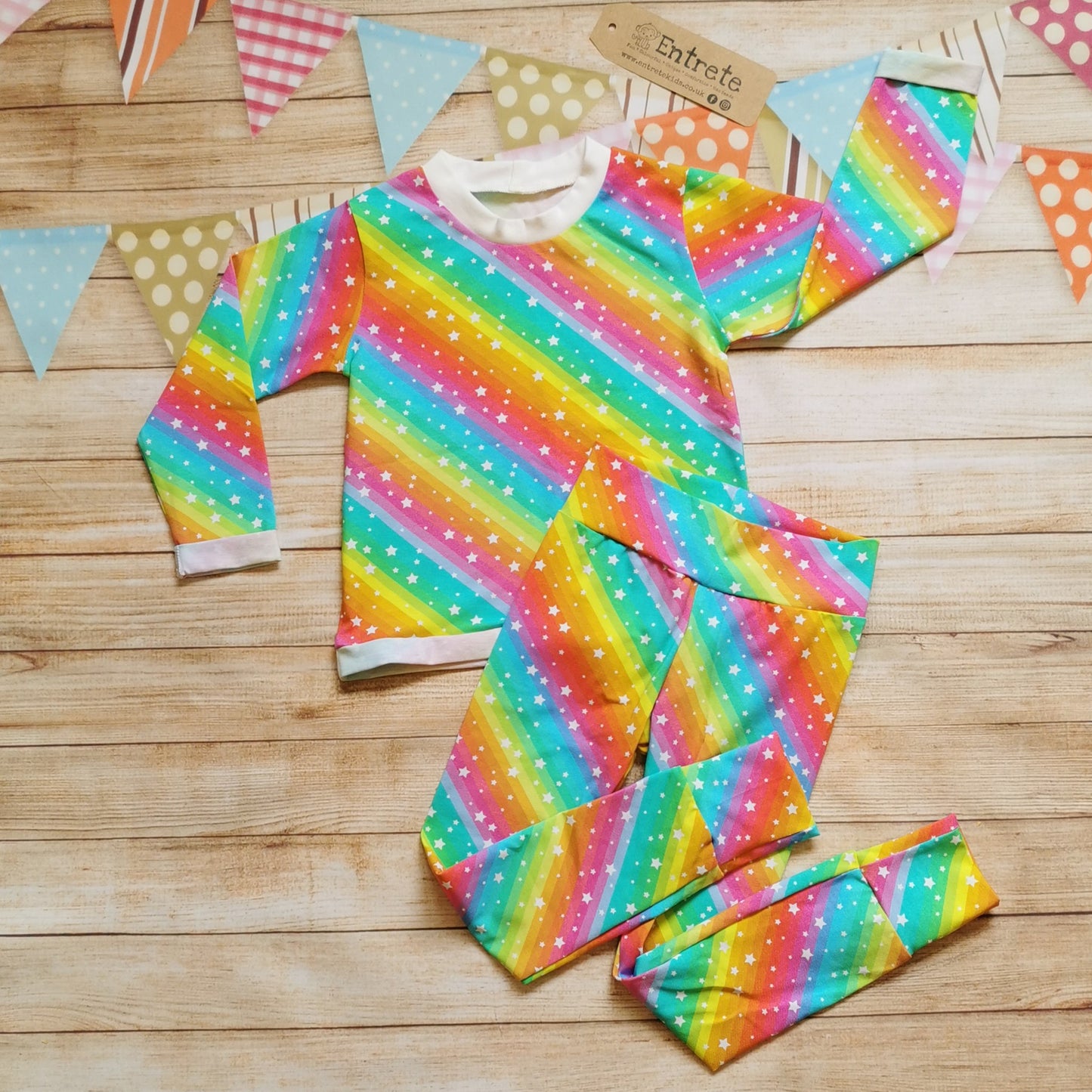 Bright Rainbow Stars long sleeve t-shirt, shown as an outfit with matching leggings. (sold separately)