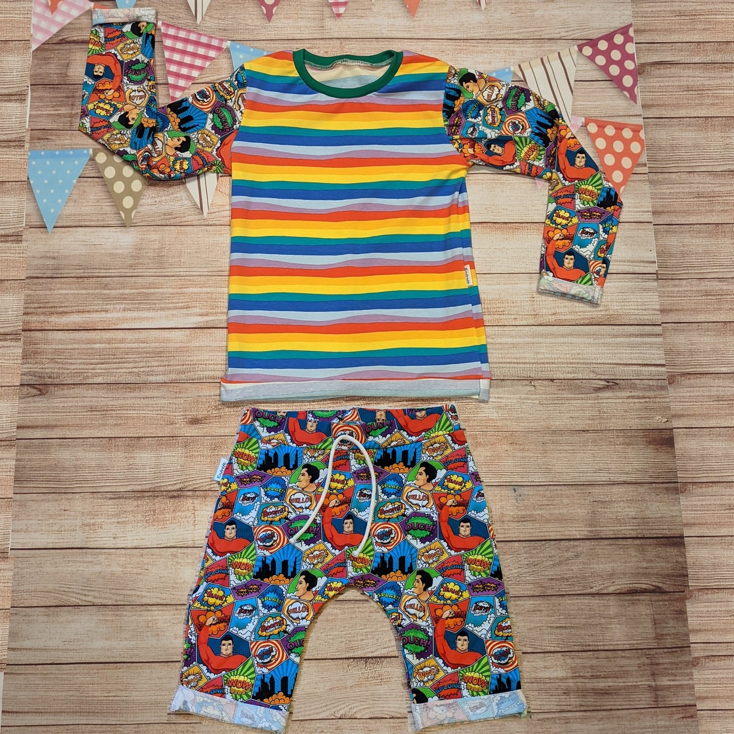 The awesome superhero tee. Handmade using superhero and red rainbow striped cotton jerseys' and green cotton ribbing. Shown with matching superhero harem shorts.