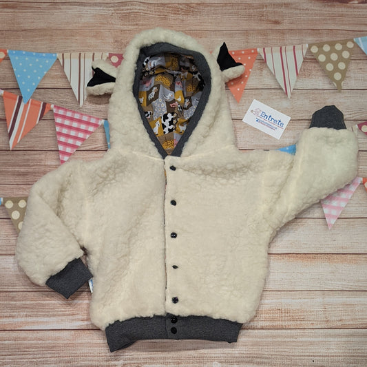 The adorable sheep hoodie handmade using sherpa fur and graphite cotton ribbing, with adorable and fun checkboard farm animals cotton jersey on the reverse.