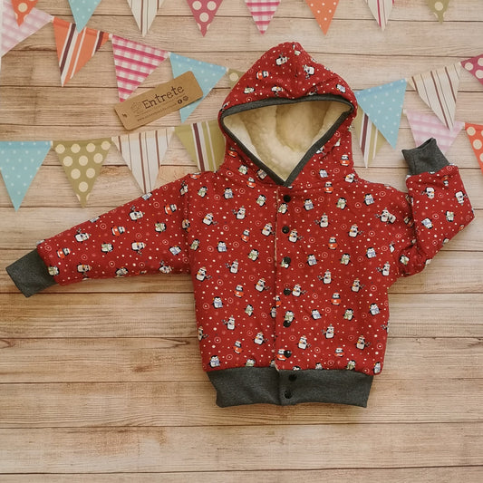 The festive and fun red christmas penguins hoodie, with warm sherpa fur.
