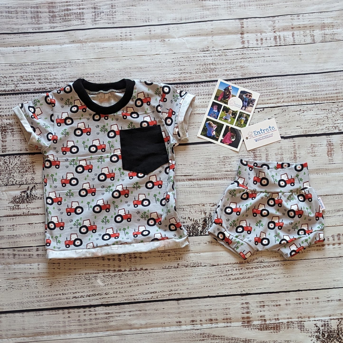 Fun red tractors on grey kids shorts. Shown as an outfit with a matching T-shirt.