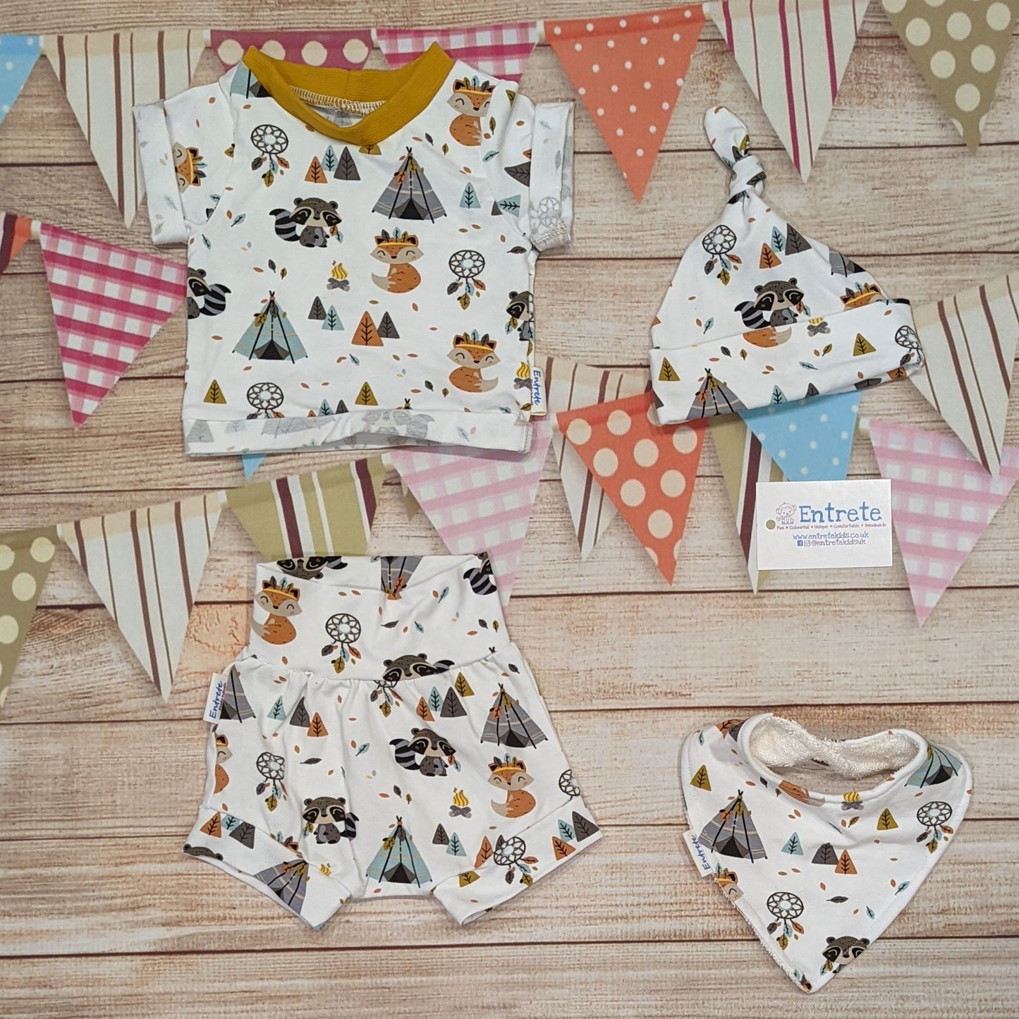 Cute foxes and raccoons shorts, handmade using native American animals cotton jersey. Shown with a matching short sleeve tee, bamboo bib and tie top hat.