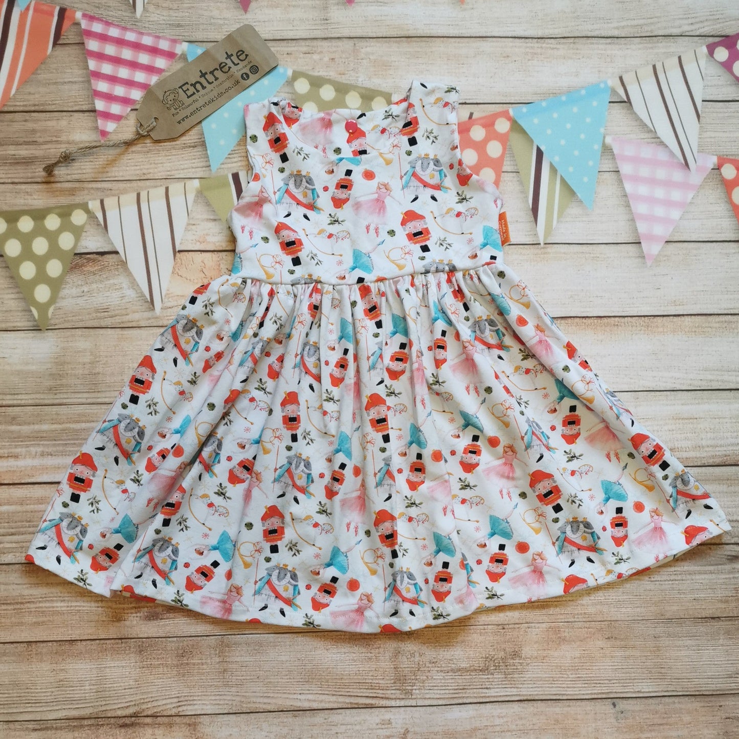 Sleeveless girls Christmas dress, handmade using the beautiful white nutcracker cotton jersey.