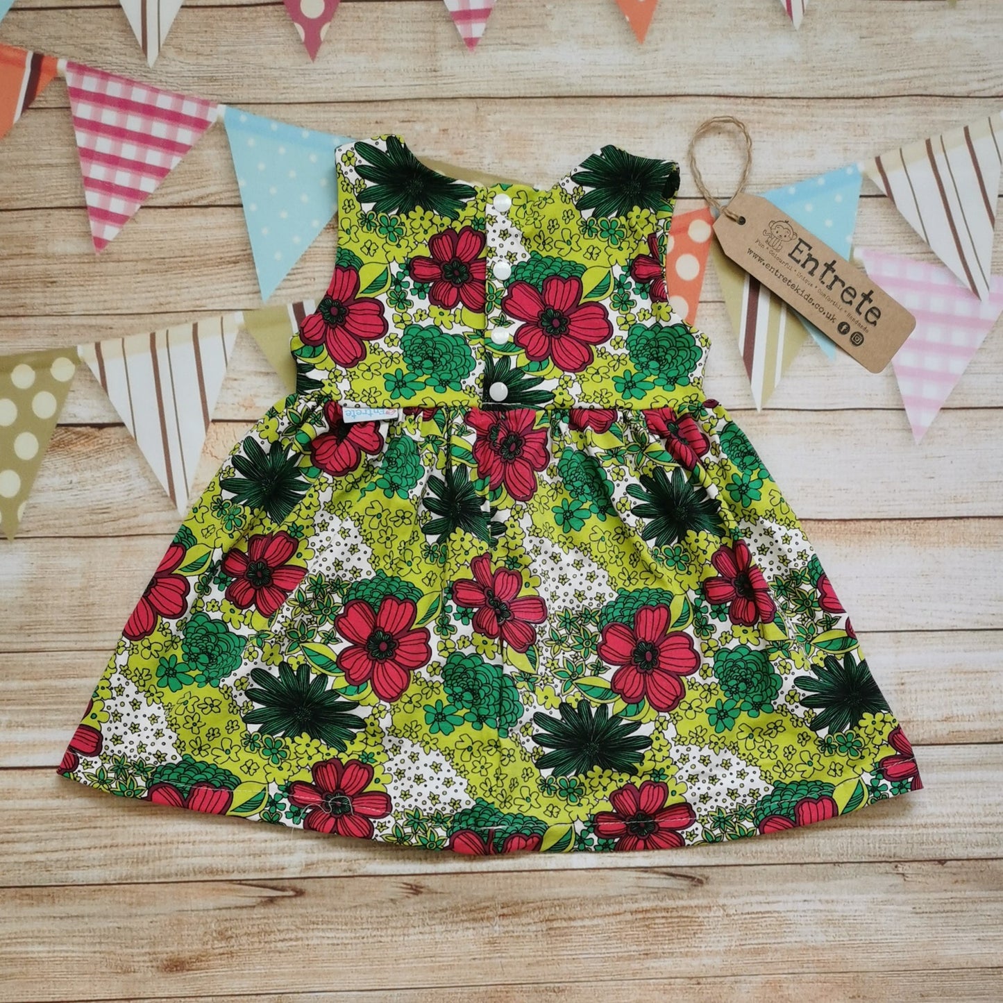 Rear view of the handmade retro flower power back popper dress.
