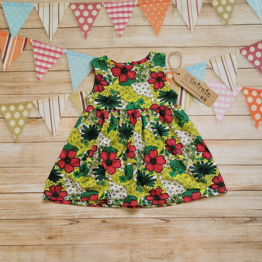 Front view of the handmade retro flower power back popper dress.