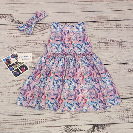 Gourgouse girls sleeveless bubblegum dress. Handmade using bubblegum pink bubbles cotton jersey. Shown with a headband available separately.