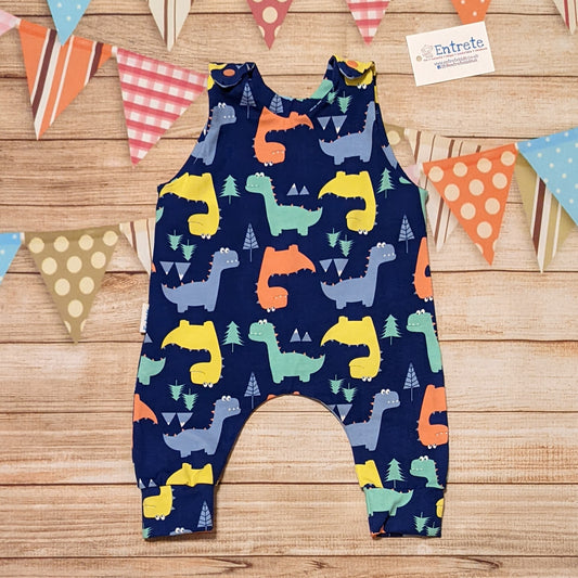 Colourful dinosaurs sleeveless romper, handmade using blue dinosaur cotton jersey.