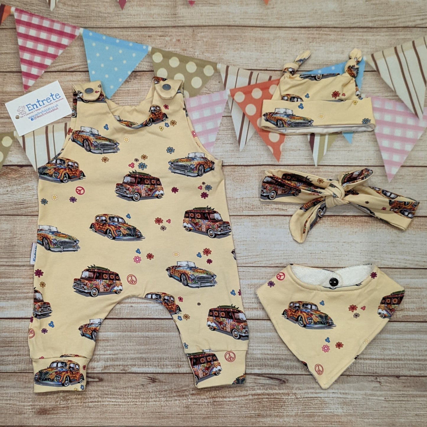 The fun retro hippie cars sleeveless romper, handmade using light yellow hippie cars cotton jersey. Shown with matching tie top hat, headband and bamboo bib.