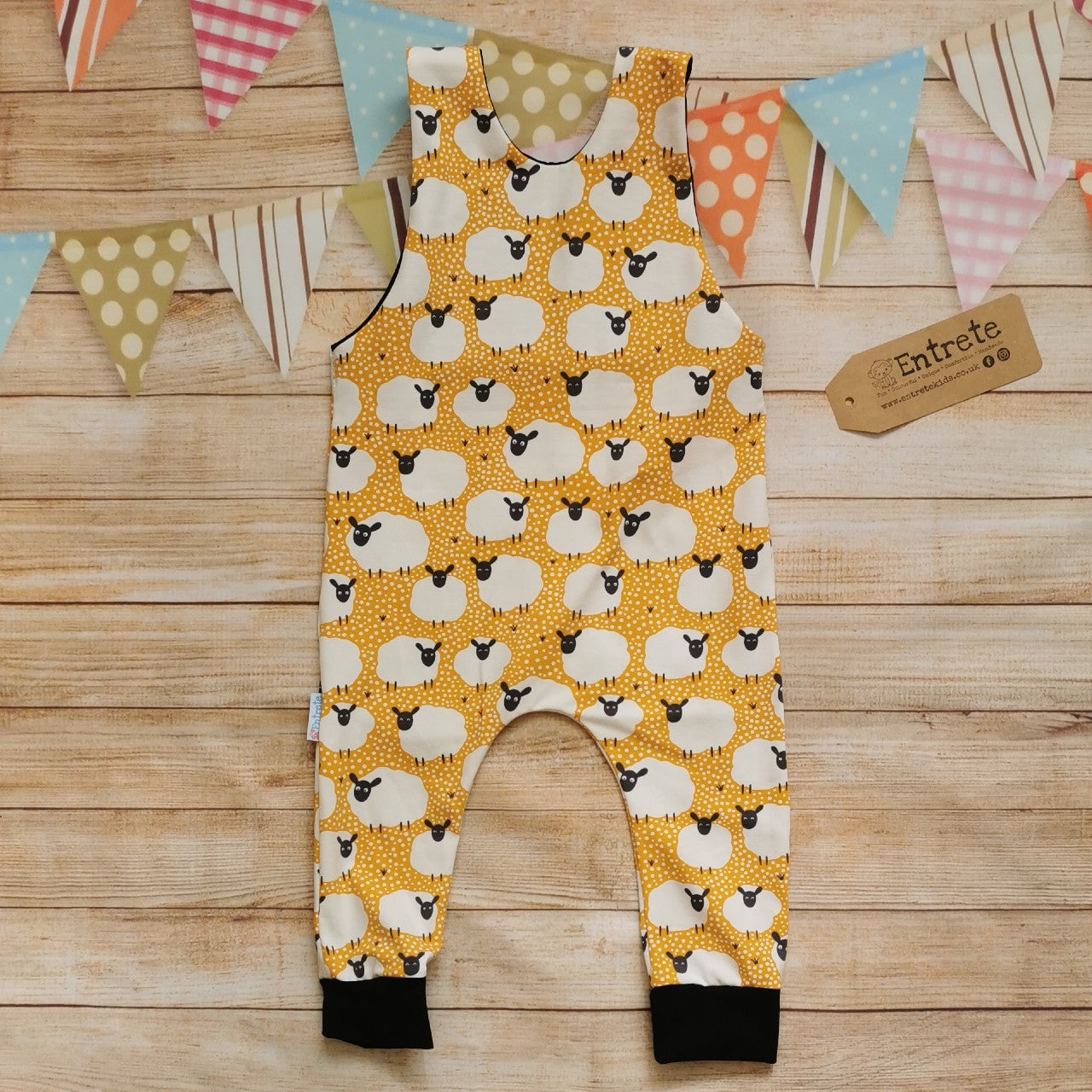 Rear of the fun mustard sheep romper, perfect for your little lamb. Handmade using mustard sheep and black cotton jerseys'.