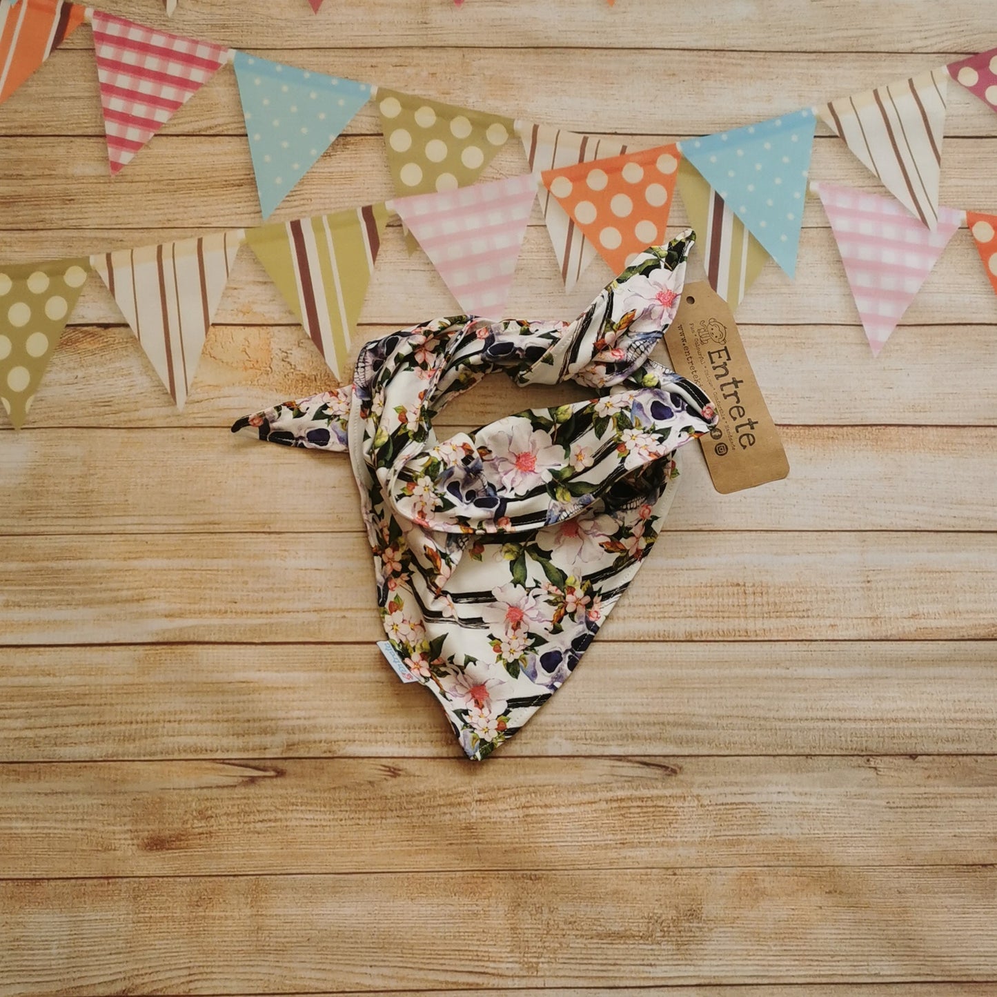 A fabulous triangle scarf, handmade using gorgeously gothic skulls and flowers cotton jersey. Shown tied.