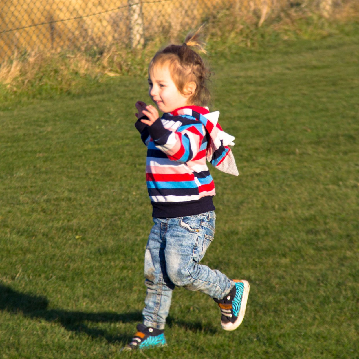 The colour striped shark hoodie is great fun! Perfect for imaginative play.