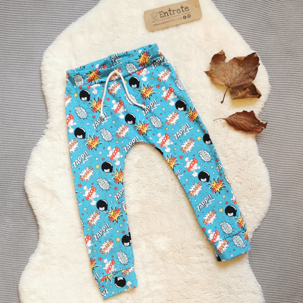 Harem joggers with elasticated waist, dropped crotch and roll-able ankle cuffs. Handmade in colourful and fun turquoise boom pow wow cotton jersey. cotton jersey.
