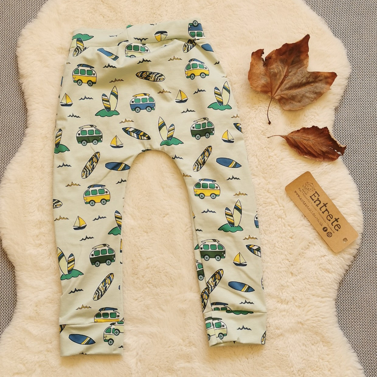 Rear view of harem joggers with elasticated waist, dropped crotch and roll-able ankle cuffs. Handmade in epic mint surf campervans cotton jersey.