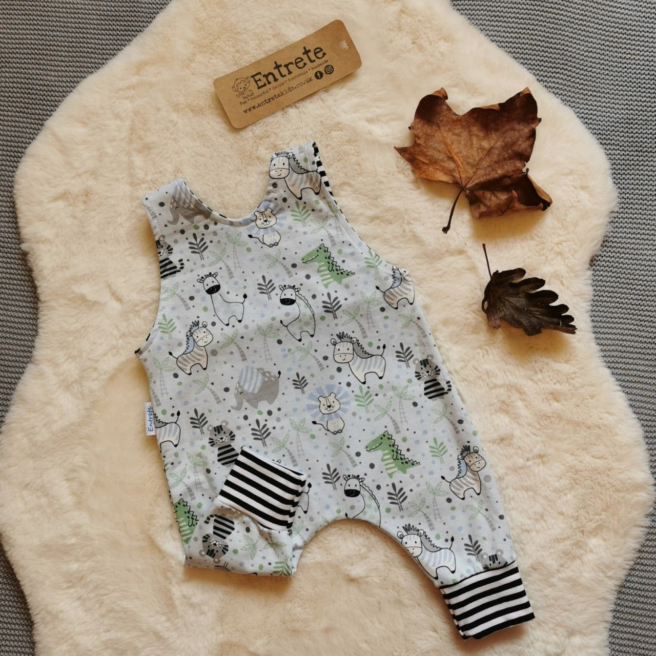 Rear of the light blue and striped kids animals romper. Perfect for any animal fanatic! Handmade using light blue kids animals and monochrome striped cotton jerseys'.