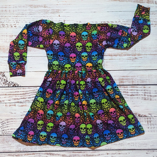 The vivid colourful neon skulls back popper dress. Handmade from soft and comfy cotton jersey. Shown with long sleeves.
