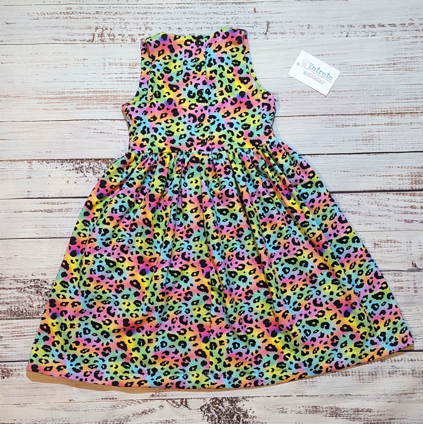 The gorgeous rainbow leopard print sleeveless dress. Lovingly handmade in soft and comfy cotton jersey. Shown from the rear.