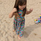 Sophie at the beach in her gorgeous rainbow leopard print sleeveless dress. Lovingly handmade in soft and comfy cotton jersey.